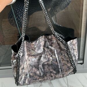 Metallic silver and black metal chain handbag. Never worn . Perfect condition.